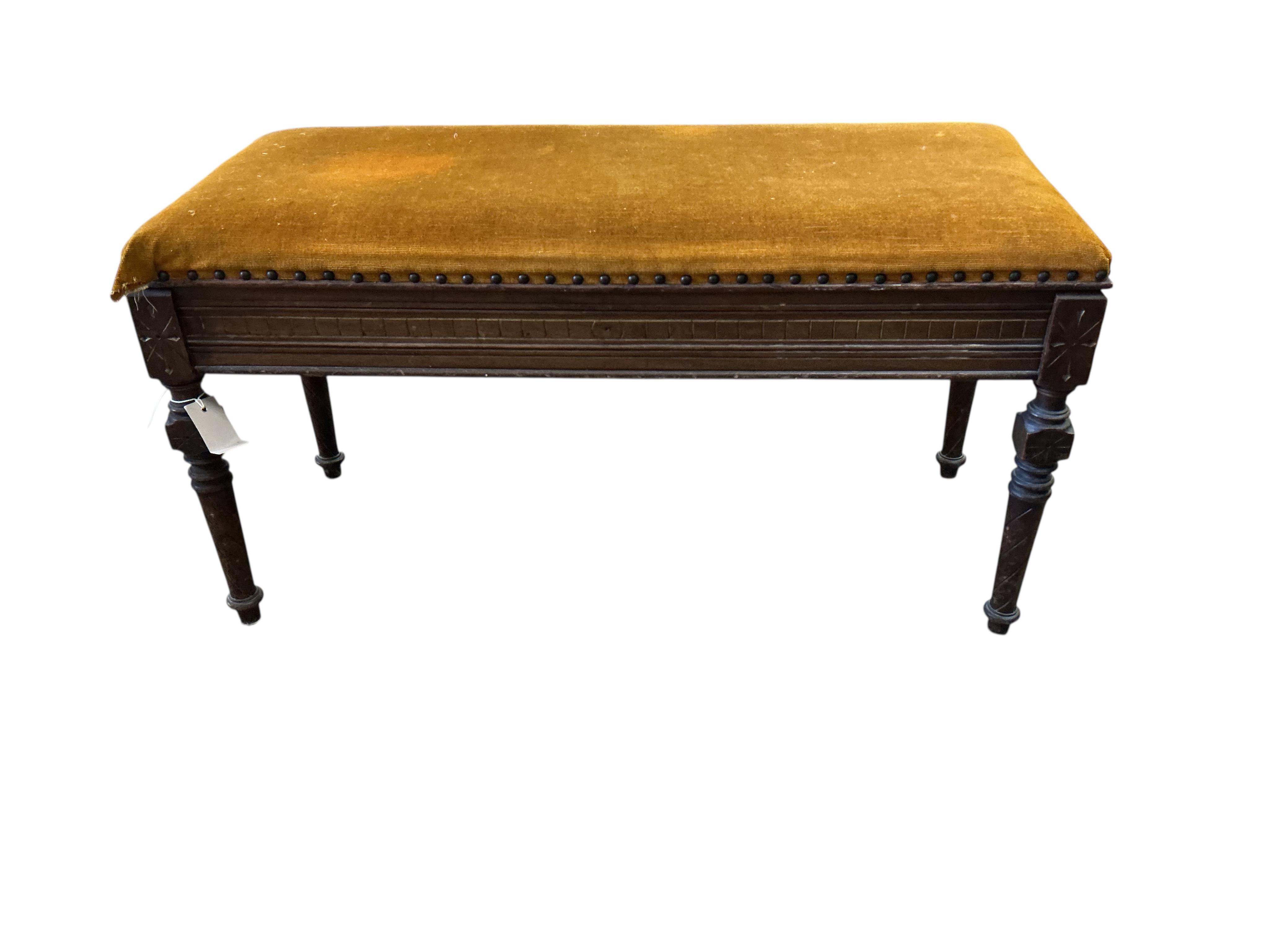 A late Victorian mahogany Aesthetic movement box seat duet piano stool, width 92cm, depth 38cm, height 47cm